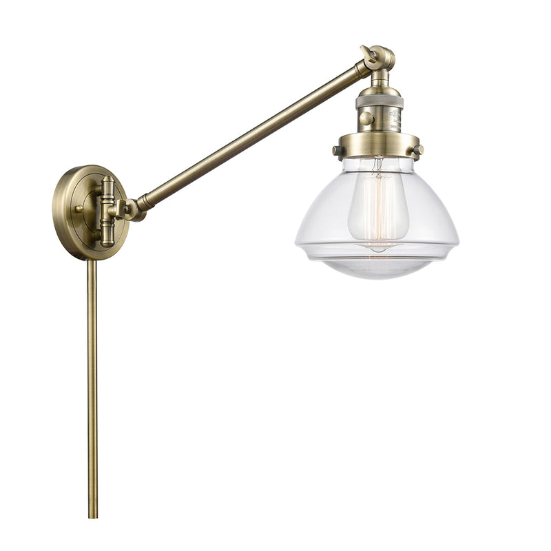 Olean Swing Arm shown in the Antique Brass finish with a Clear shade