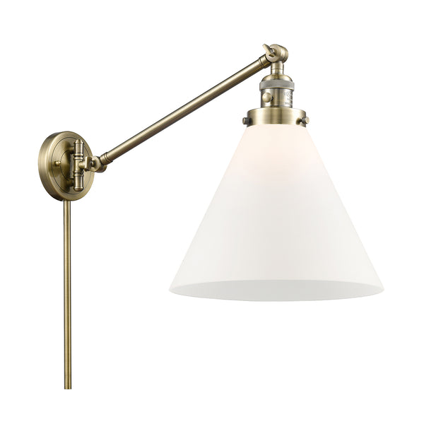 Cone Swing Arm shown in the Antique Brass finish with a Matte White shade