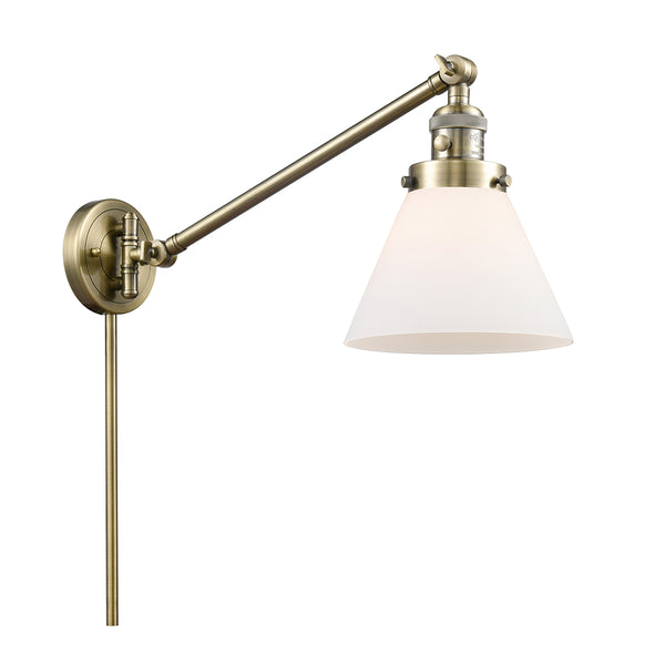 Cone Swing Arm shown in the Antique Brass finish with a Matte White shade