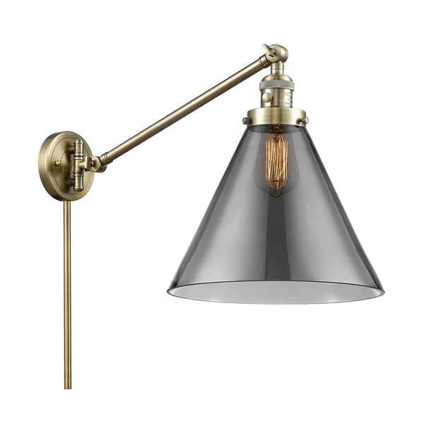 Cone Swing Arm shown in the Antique Brass finish with a Plated Smoke shade