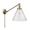 Cone Swing Arm shown in the Antique Brass finish with a Seedy shade