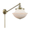 Oxford Swing Arm shown in the Antique Brass finish with a Matte White shade