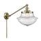 Oxford Swing Arm shown in the Antique Brass finish with a Seedy shade