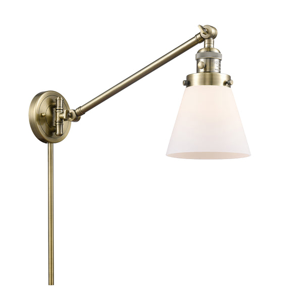 Cone Swing Arm shown in the Antique Brass finish with a Matte White shade