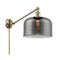 Bell Swing Arm shown in the Antique Brass finish with a Plated Smoke shade