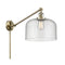 Bell Swing Arm shown in the Antique Brass finish with a Seedy shade