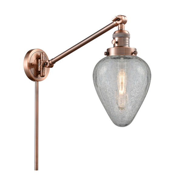 Geneseo Swing Arm shown in the Antique Copper finish with a Clear Crackled shade