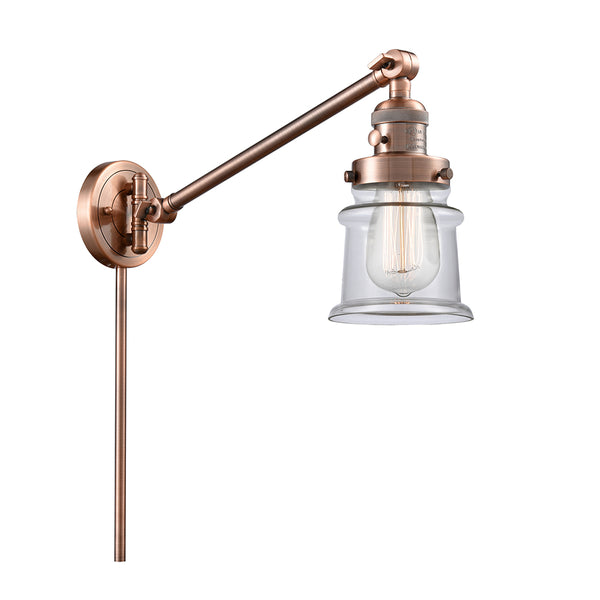 Canton Swing Arm shown in the Antique Copper finish with a Clear shade