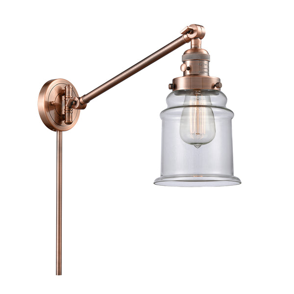 Canton Swing Arm shown in the Antique Copper finish with a Clear shade