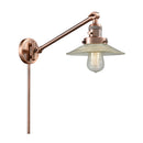 Halophane Swing Arm shown in the Antique Copper finish with a Clear Halophane shade