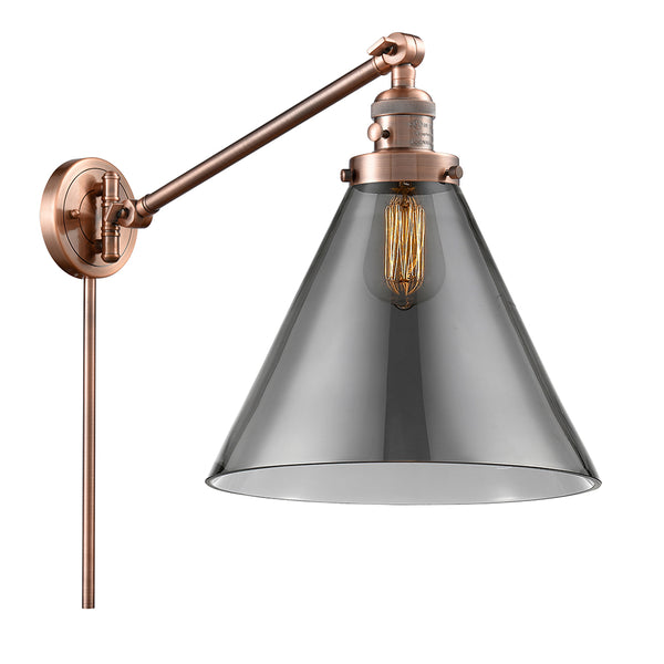Cone Swing Arm shown in the Antique Copper finish with a Plated Smoke shade