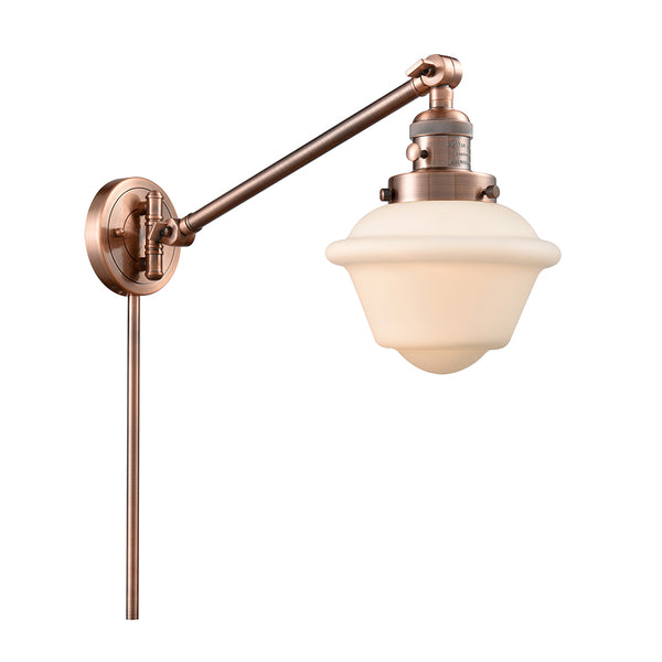 Oxford Swing Arm shown in the Antique Copper finish with a Matte White shade