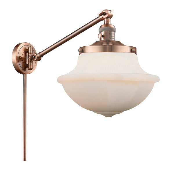 Oxford Swing Arm shown in the Antique Copper finish with a Matte White shade
