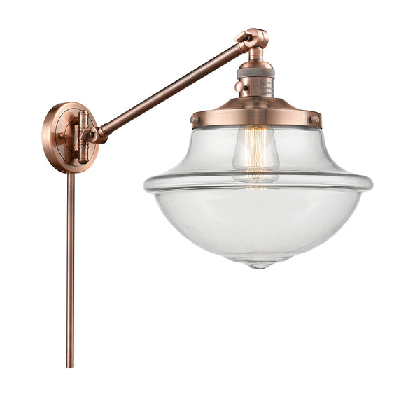 Oxford Swing Arm shown in the Antique Copper finish with a Clear shade