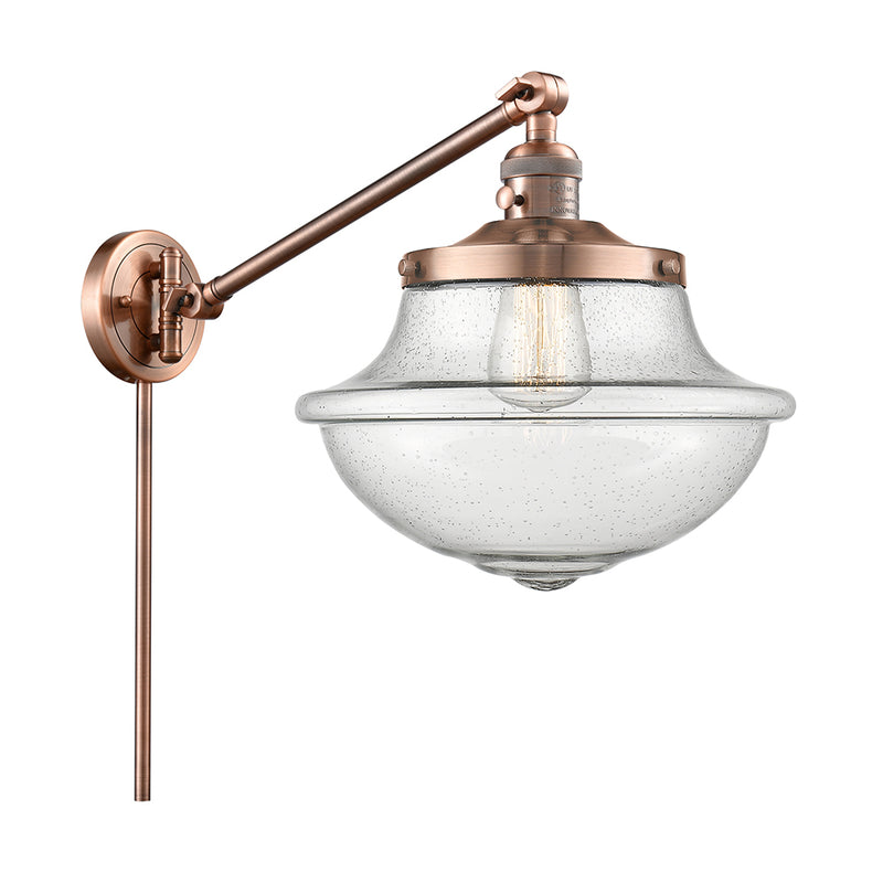Oxford Swing Arm shown in the Antique Copper finish with a Seedy shade