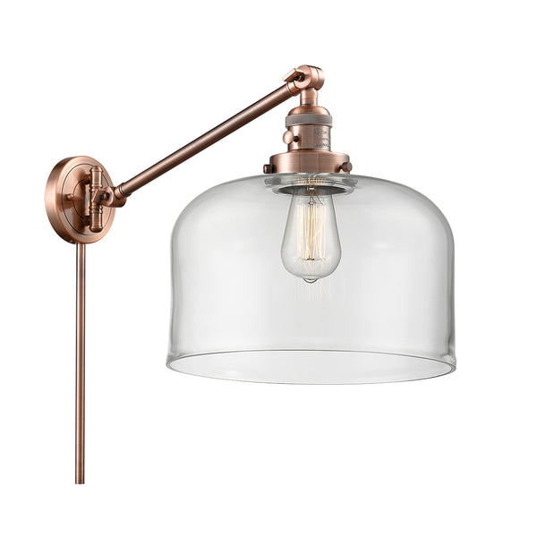 Bell Swing Arm shown in the Antique Copper finish with a Clear shade