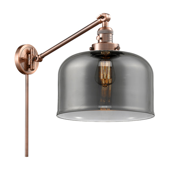 Bell Swing Arm shown in the Antique Copper finish with a Plated Smoke shade