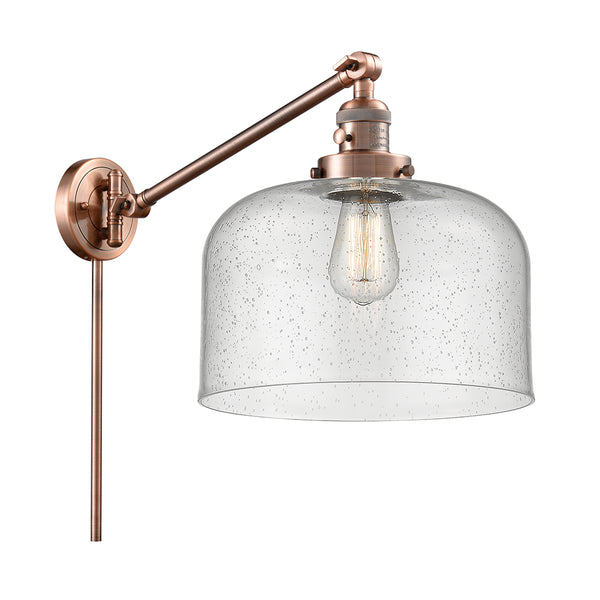 Bell Swing Arm shown in the Antique Copper finish with a Seedy shade