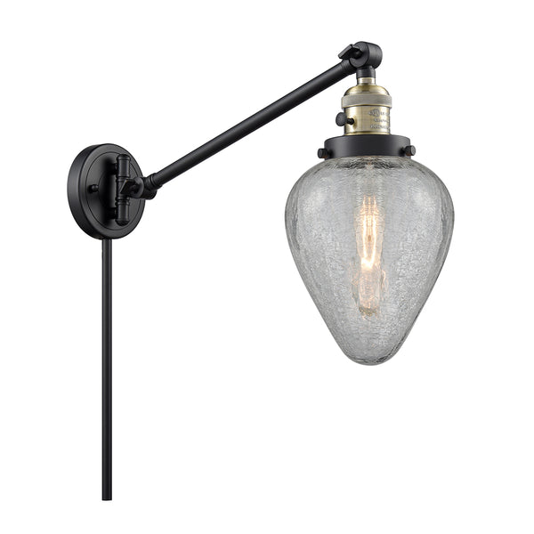 Geneseo Swing Arm shown in the Black Antique Brass finish with a Clear Crackled shade