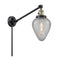 Geneseo Swing Arm shown in the Black Antique Brass finish with a Clear Crackled shade