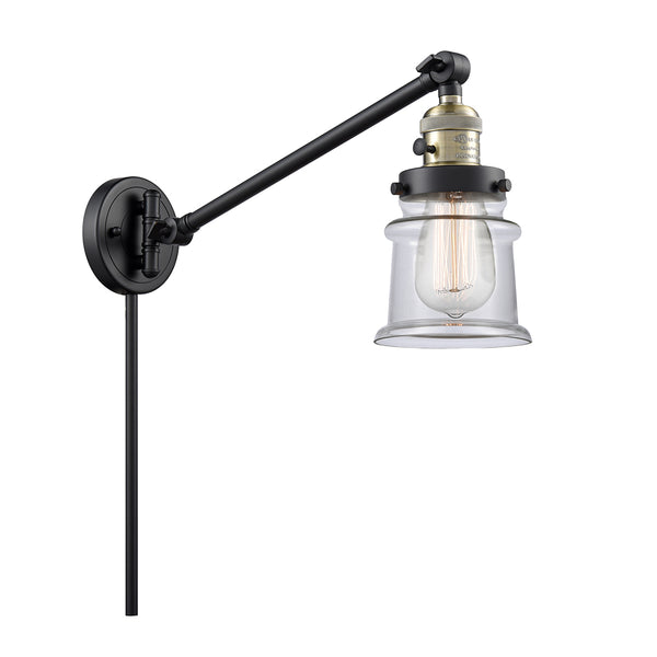 Canton Swing Arm shown in the Black Antique Brass finish with a Clear shade