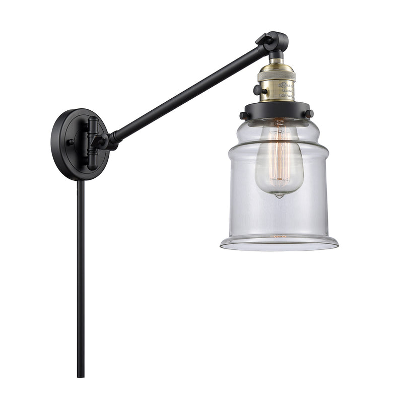 Canton Swing Arm shown in the Black Antique Brass finish with a Clear shade