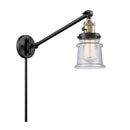 Canton Swing Arm shown in the Black Antique Brass finish with a Seedy shade