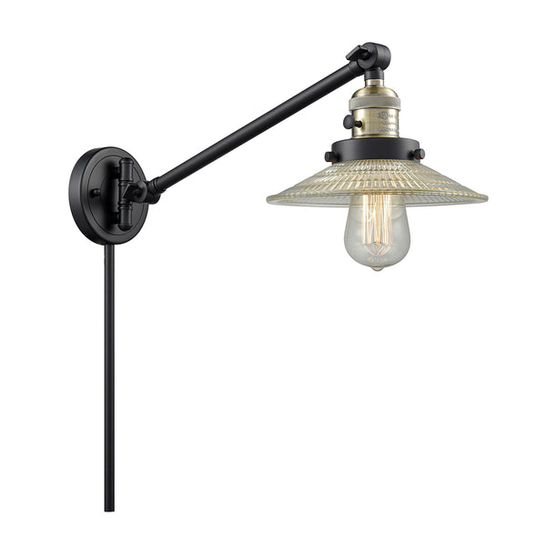 Halophane Swing Arm shown in the Black Antique Brass finish with a Clear Halophane shade
