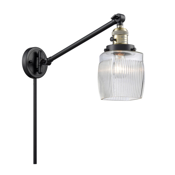 Colton Swing Arm shown in the Black Antique Brass finish with a Clear Halophane shade