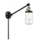 Dover Swing Arm shown in the Black Antique Brass finish with a Clear shade