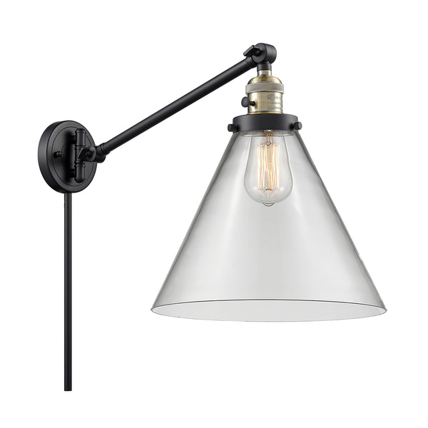 Cone Swing Arm shown in the Black Antique Brass finish with a Clear shade
