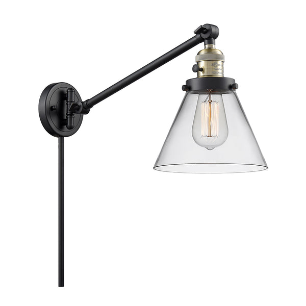 Cone Swing Arm shown in the Black Antique Brass finish with a Clear shade