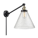 Cone Swing Arm shown in the Black Antique Brass finish with a Seedy shade