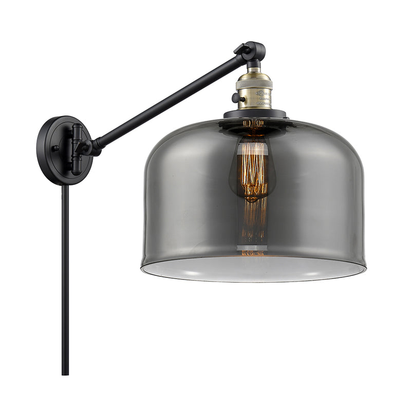 Bell Swing Arm shown in the Black Antique Brass finish with a Plated Smoke shade