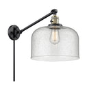 Bell Swing Arm shown in the Black Antique Brass finish with a Seedy shade