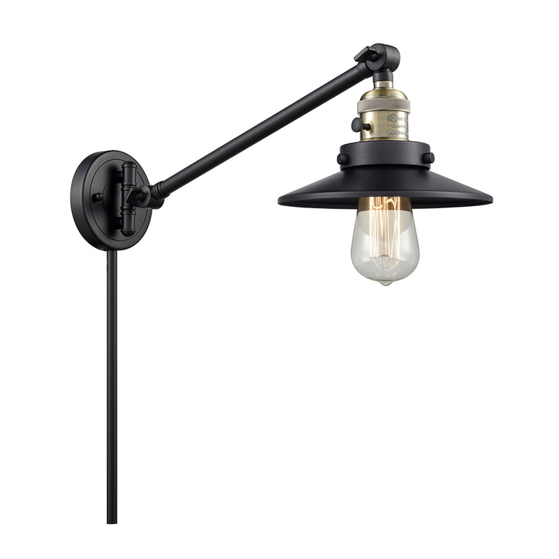 Railroad Swing Arm shown in the Black Antique Brass finish with a Matte Black shade