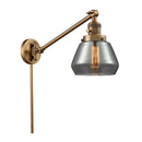 Fulton Swing Arm shown in the Brushed Brass finish with a Plated Smoke shade