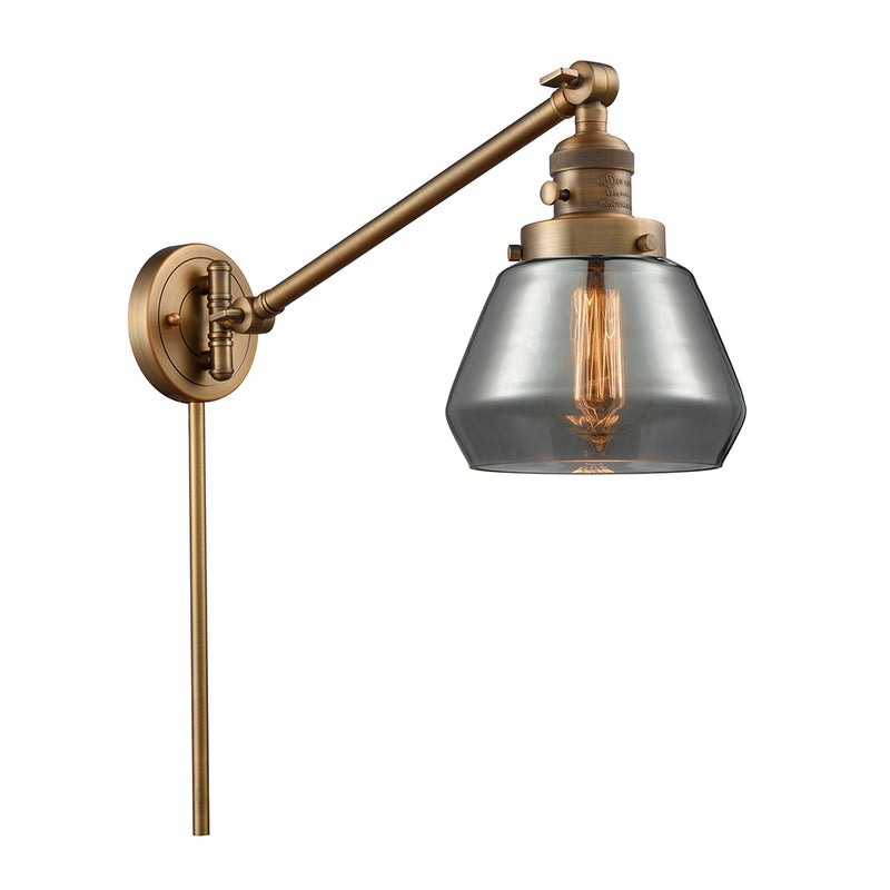 Fulton Swing Arm shown in the Brushed Brass finish with a Plated Smoke shade