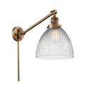 Seneca Falls Swing Arm shown in the Brushed Brass finish with a Clear Halophane shade