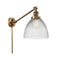 Seneca Falls Swing Arm shown in the Brushed Brass finish with a Clear Halophane shade