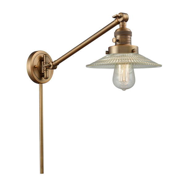 Halophane Swing Arm shown in the Brushed Brass finish with a Clear Halophane shade