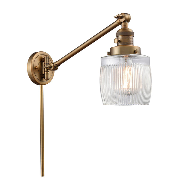 Colton Swing Arm shown in the Brushed Brass finish with a Clear Halophane shade