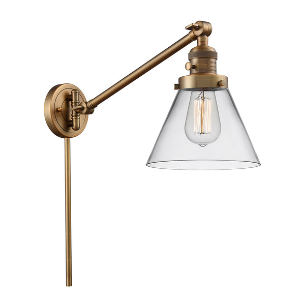 Cone Swing Arm shown in the Brushed Brass finish with a Clear shade