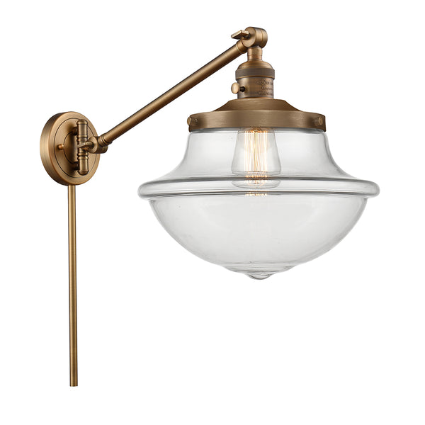 Oxford Swing Arm shown in the Brushed Brass finish with a Clear shade