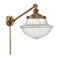 Oxford Swing Arm shown in the Brushed Brass finish with a Clear shade