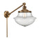 Oxford Swing Arm shown in the Brushed Brass finish with a Seedy shade