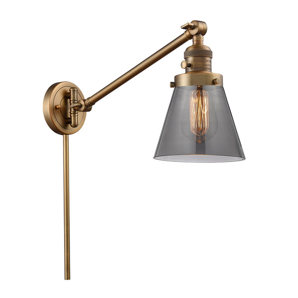 Cone Swing Arm shown in the Brushed Brass finish with a Plated Smoke shade