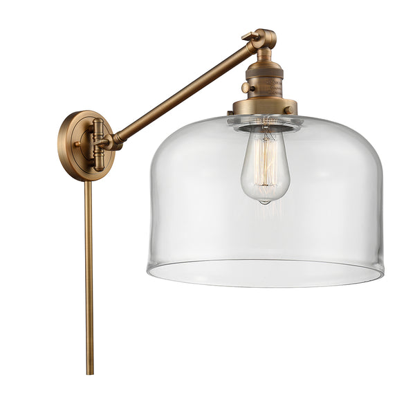 Bell Swing Arm shown in the Brushed Brass finish with a Clear shade
