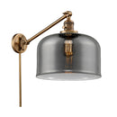 Bell Swing Arm shown in the Brushed Brass finish with a Plated Smoke shade