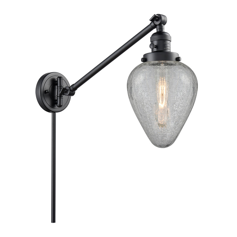 Geneseo Swing Arm shown in the Matte Black finish with a Clear Crackled shade